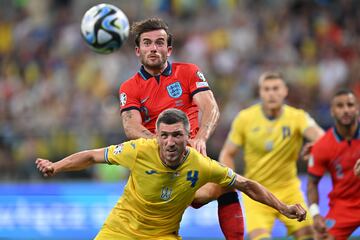 Serhiy Kryvtsov of Ukraine and Ben Chilwell (back) of England 