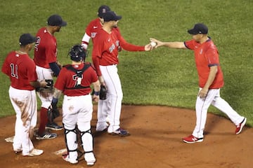 BOSTON, MA - JUNE 30: Martin Perez #54 of the Boston Red Sox is pulled by manager Alex Cora in the sixth inning of a game against the Kansas City Royals at Fenway Park on June 30, 2021 in Boston, Massachusetts. Adam Glanzman/Getty Images/AFP